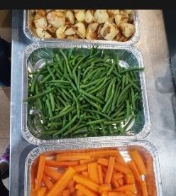 Catering side dishes of roast potatoes, green beans and carrots Catering side dishes of roast potatoes, green beans and carrots